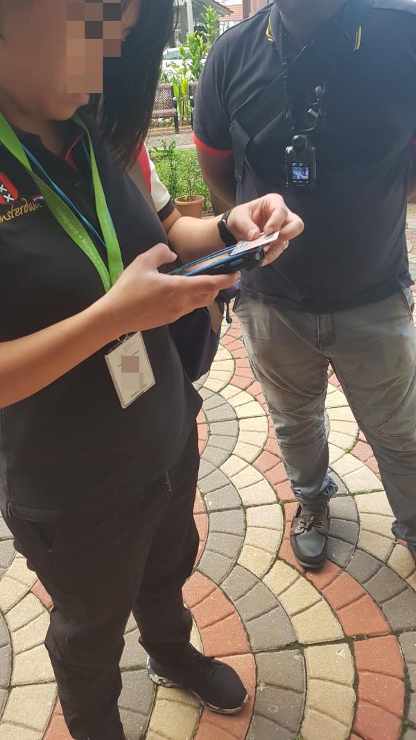 NEA officers fined resident for holding on to unlit cigarette
