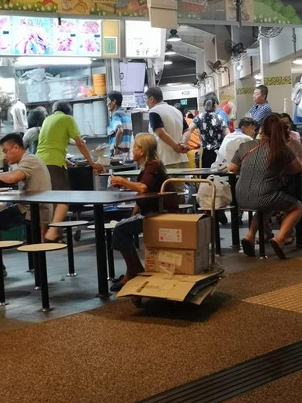 Old woman asks for plate of food from stranger, after her exercise regime collecting cardboard